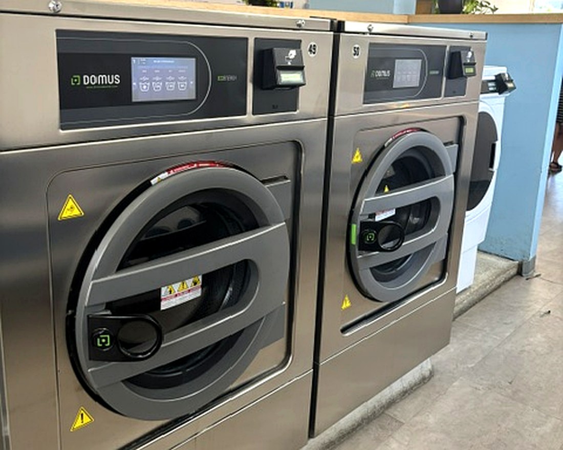 The big DOMUS high-capacity machines at Scrubs Laundry in Chelsea — large enough for comforters and bulky loads