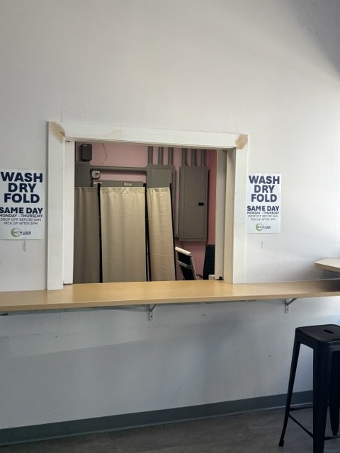 Wash, dry & fold drop-off counter at Scrubs Laundry